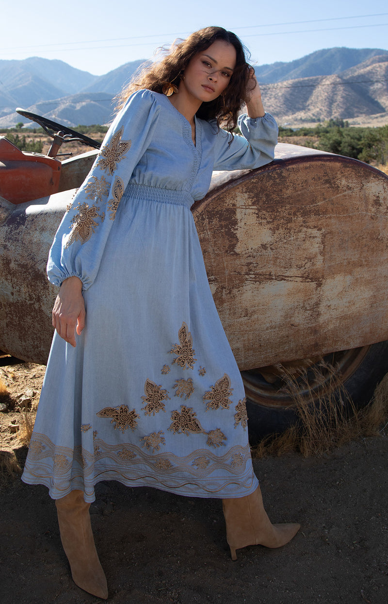 Paulina Embroidered Dress, color_light blue

Woman wearing a light blue dress with gold embroidery against a wooden background