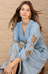 Paulina Embroidered Dress, color_light blue

Woman wearing a light blue dress with gold embroidery against a wooden background